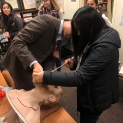 A PINC student tries out one of the training models